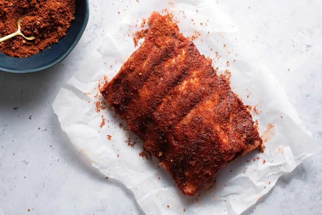 Seasoned the ribs with salt, pepper, paprika, garlic powder, onion powder, brown sugar
